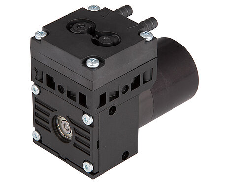 A customized NMP 850 HP is used to evacuate air and create a constant vacuum.